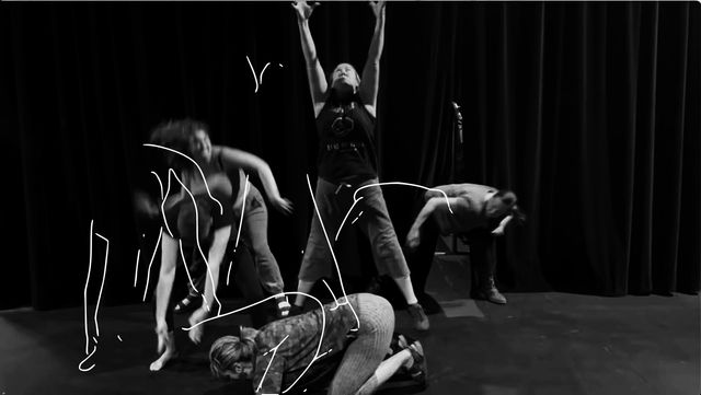 Five actors creating a scene: one center on the ground; one behind, arms raised; others in motion around. Offset line-drawings of their bodies are scribbled on top